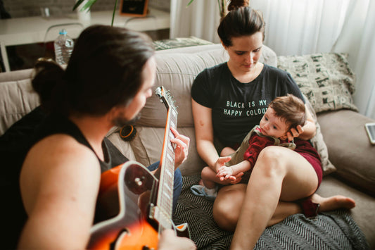 Family playing music with baby