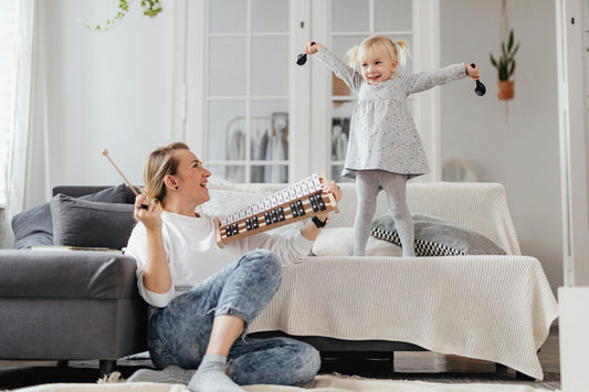 Mother and toddler making music