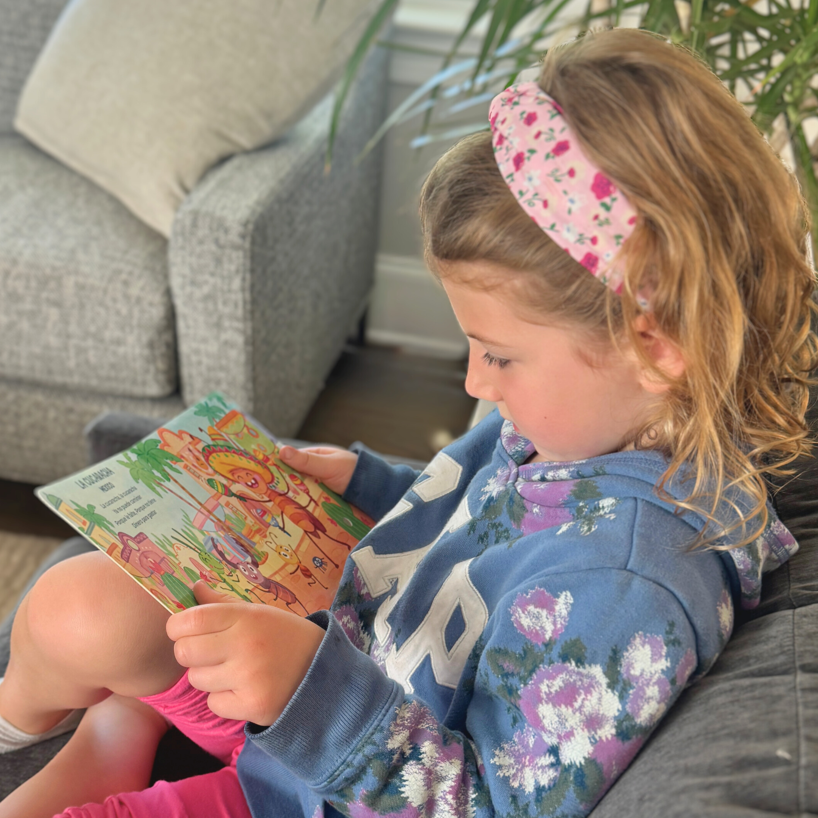 Little girl reading classical music book by Pirouette Kids