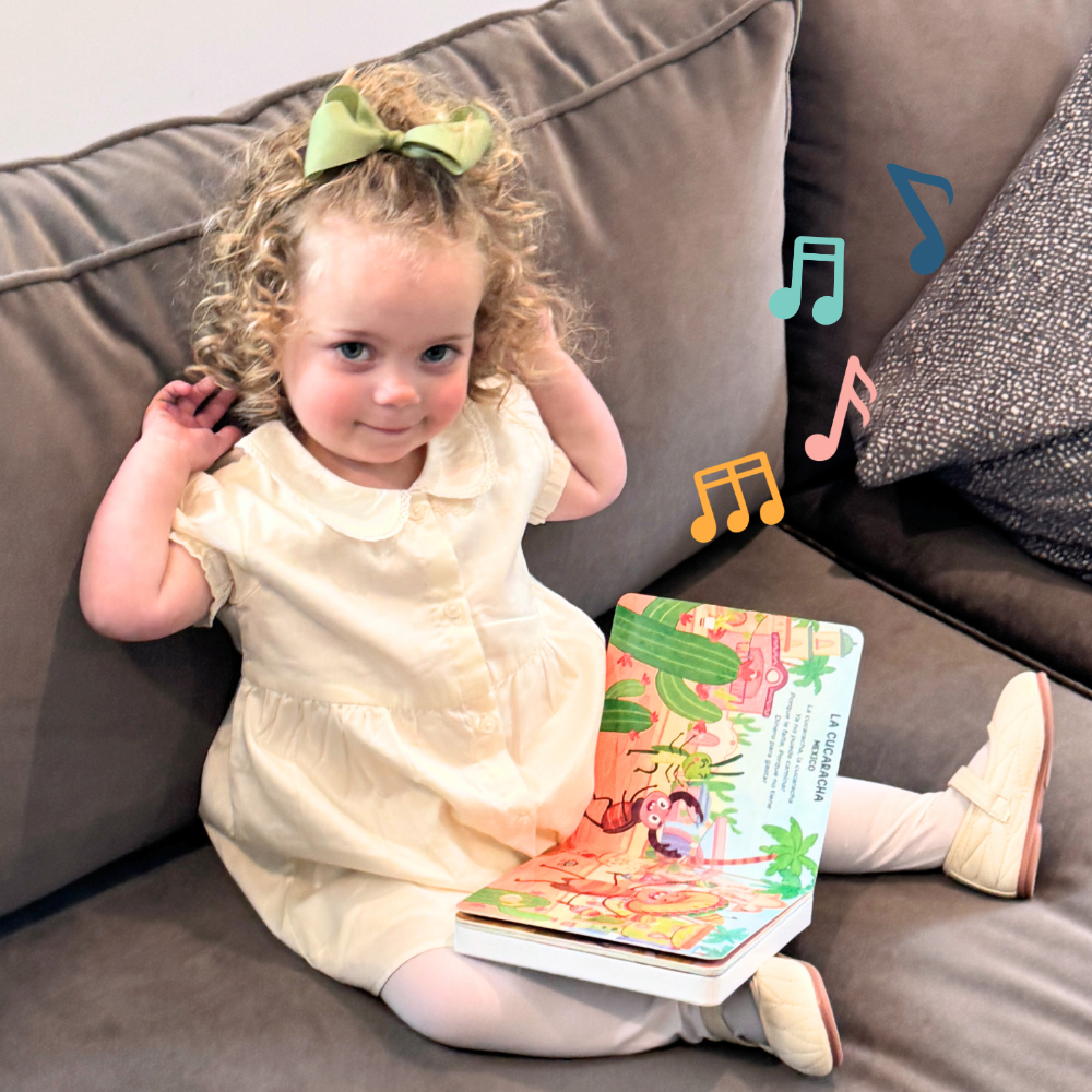 toddler listening to music coming from world music book by Pirouette Kids