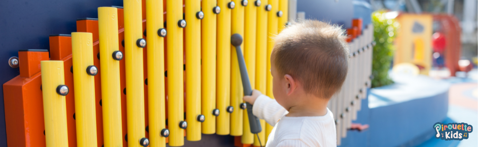 1 year old boy playing music