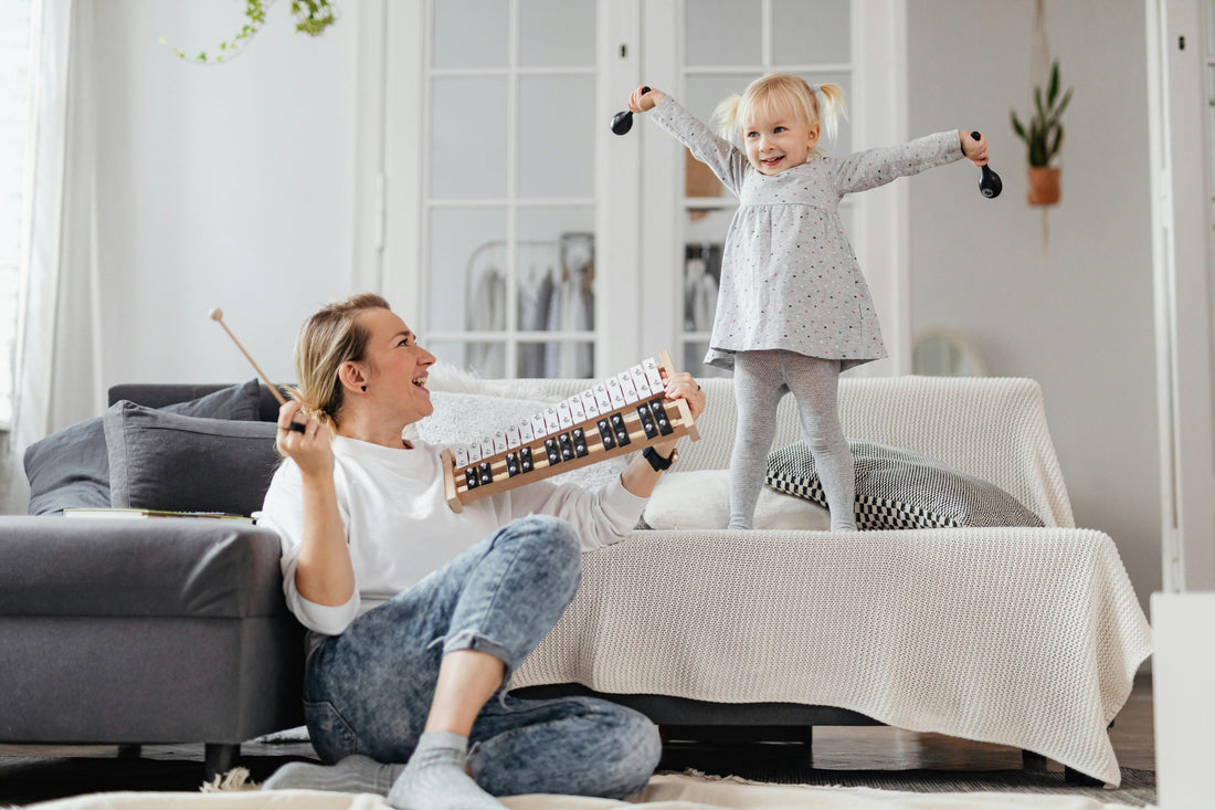 Mother and toddler making music