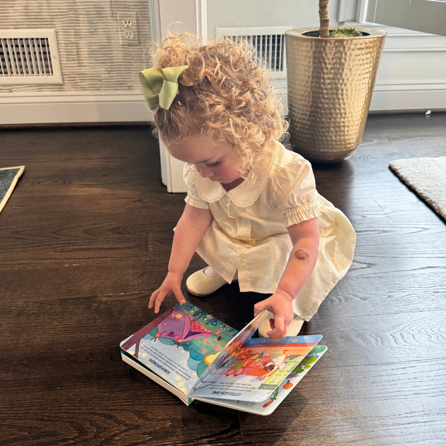 little girl reading folk music book by Pirouette Kids